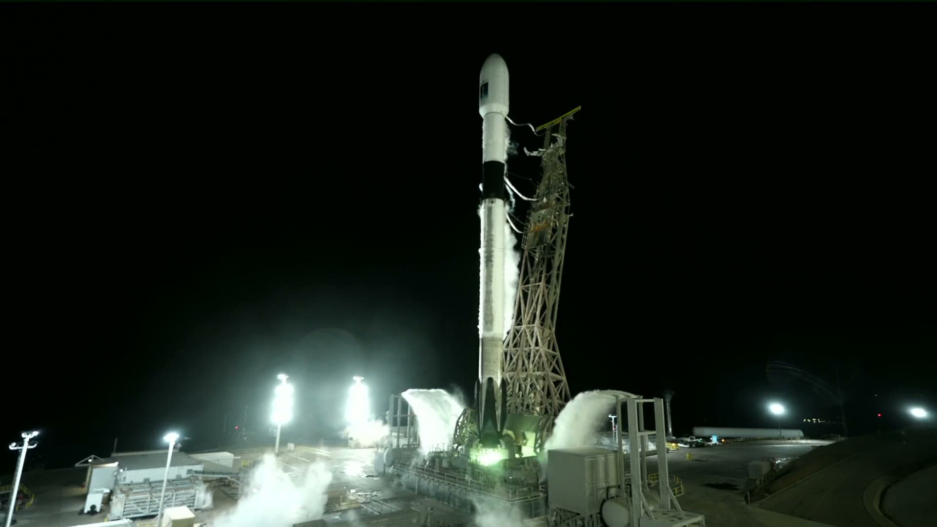 Falcon 9 on the pad at night at SLC-4E with floodlights