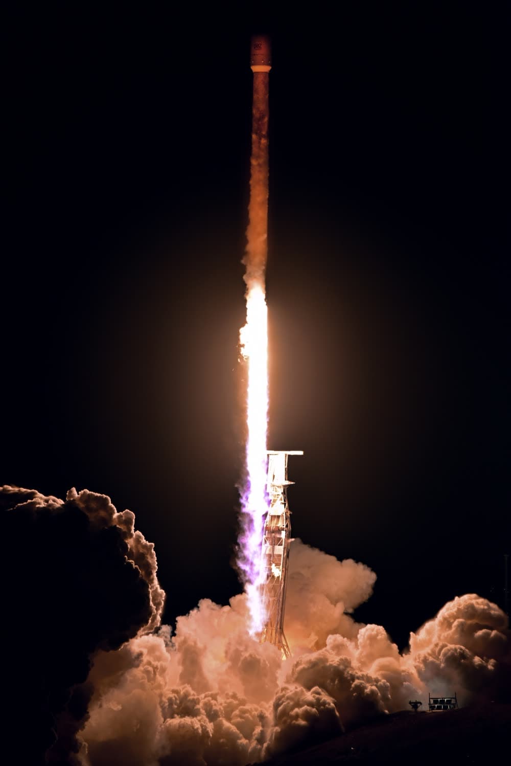 Falcon 9 climbing through pre-dawn sky